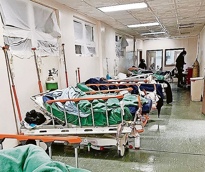 An overcrowded and temporary A&E ward at the PMH, which is plagued by poor conditions, leaks, and rodent issues.