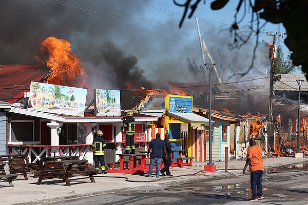 A massive fire engulfs wooden structures at the Fish Fry at Arawak Cay on November 16, 2025. Photo: Dante Carrer/Tribune