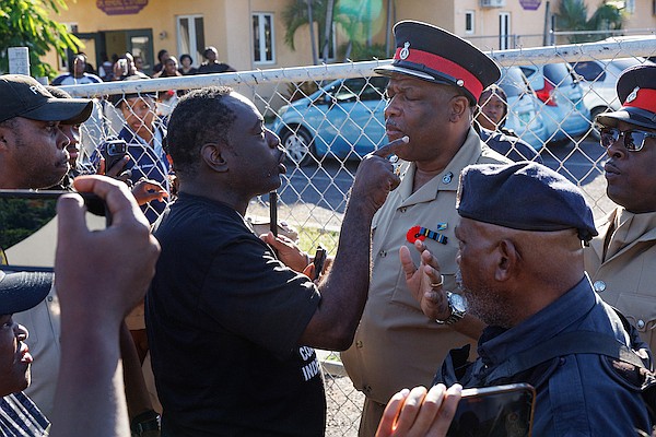COI Leader Lincoln Bain clashed with police officers over restricted access to the polling site during the advanced poll for the Golden Isles by-election outside Remnant Tabernacle of Praise Church on November 17, 2025. Photo: Dante Carrer/Tribune Staff