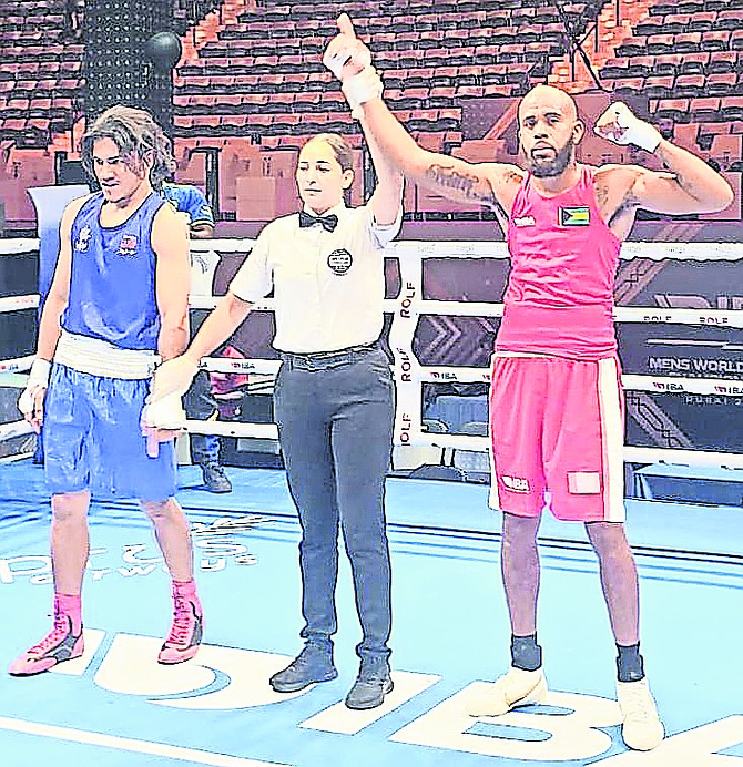 Rashield “Raw” Williams has his hand raised in victory in Dubai.