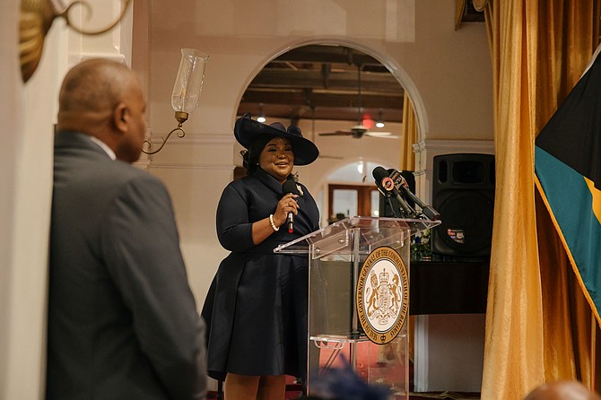 Governor General Dame Cynthia ‘Mother’ Pratt swears in newly appointed senator D’Asante Small yesterday at an offical ceremony at Government House.  Photo: Shawn Hanna
