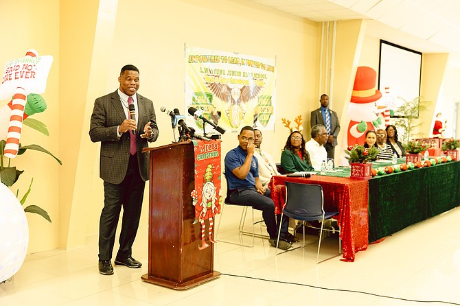 US AMBASSADOR Herschel Walker and his wife, Julie Walker, visit the Fox Hill Community Centre alongside Fox Hill MP Fred Mitchell, engaging with students of the LW Young Jr High Boys and Girls Youth Empowerment Club during their Christmas Social held at the Fox Hill Community Center. Photos: Shawn Hanna