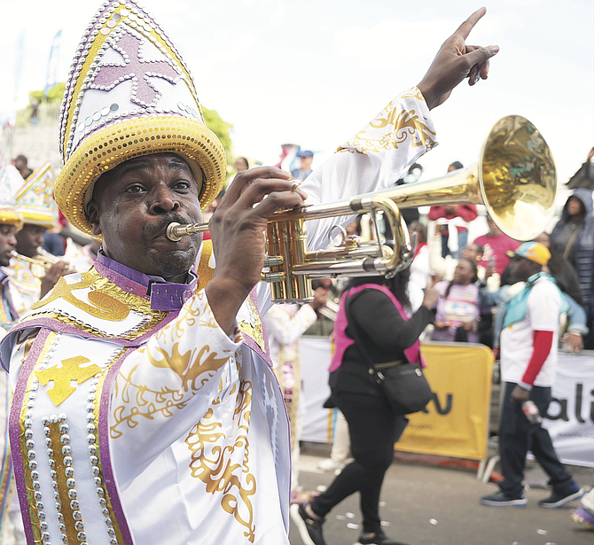 A ONE FAMILY trumpeteer plays on Bay Street during the New Year’s Day Junkanoo Parade. Photo: Nikia Charlton/Chappell Whyms Jr