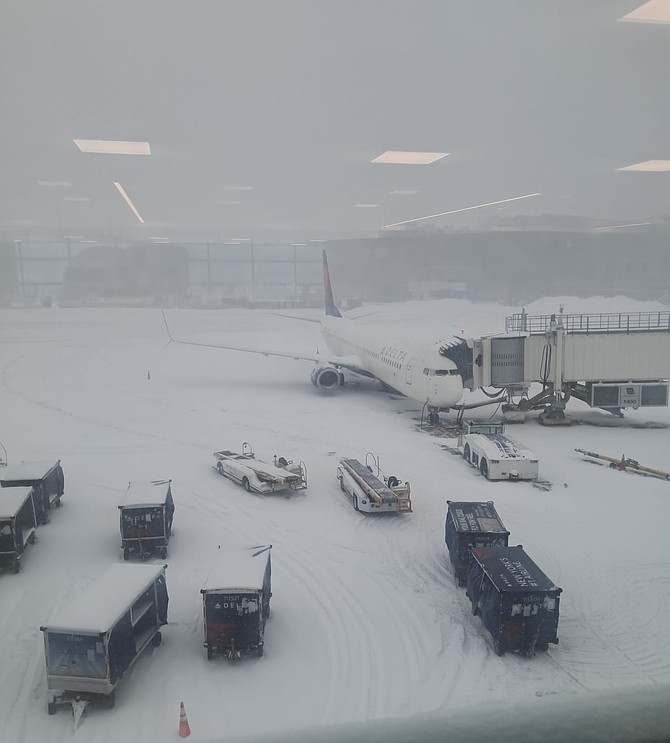 EARL Thompson’s view of the tarmac at an airport in New York as the winter storm dumped layers of snow, stranding him and his relatives.