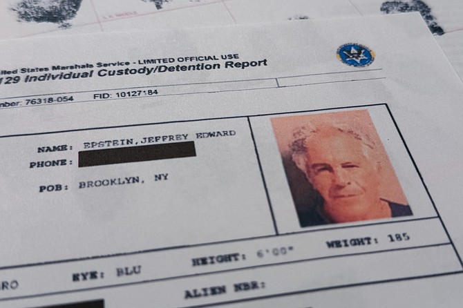 A document that was included in the U.S. Department of Justice release of the Jeffrey Epstein files is photographed Sunday, Feb. 1, 2026, shows the report when Epstein was taken into custody on July 6, 2019. (AP Photo/Jon Elswick)