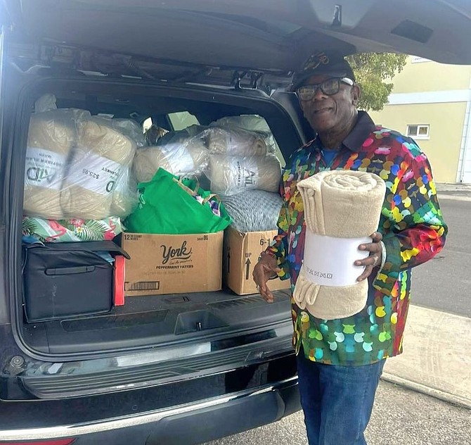 Bishop Walter Hanchell, founder of Great Commission Ministries, distrubuting blankets to homeless people over the weekend.