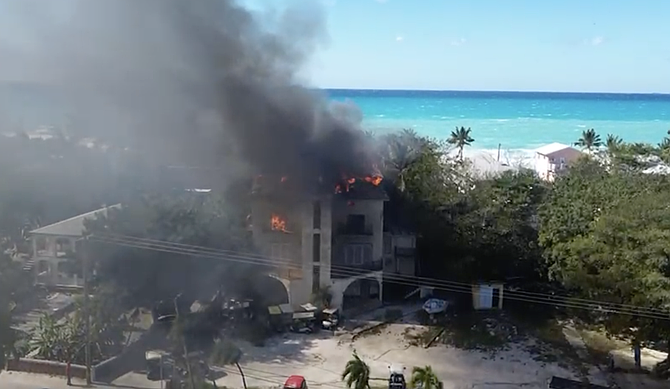 Drone footage shows the blaze on the upper floors of All My Children Hotel in Alice Town, Bimini on February 1, 2026.