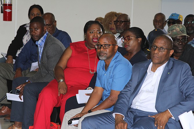 FNM leader Michael Pintard and MP for East Grand Bahama Kwasi Thompson sit in the audience at the GBPA town hall meeting on the arbitration ruling on March 9, 2026. Photo: Vandyke Hepburn
