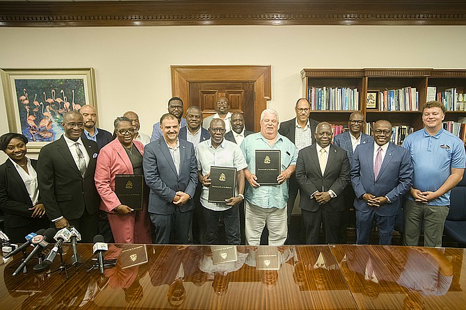 PRIME MINSTER Philip ‘Brave’ Davis, Deputy Prime Minister Chester Cooper, and Minister of Works Clay Sweeting sign a contract with Rowdy Boys Construction to begin the construction of two airports on Exuma at the Office of the Prime Minster on March 31, 2026. Photo: Chappell Whyms Jr