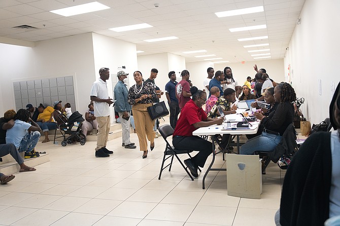 Residents on long lines and crowded waiting areas waiting to be served at Town Center Mall on April 8, 2026.