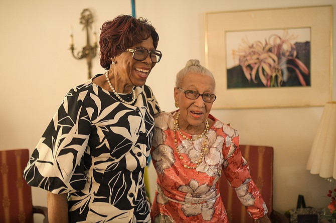 Centenarian Dorothea Louise Strachan (right) shares a laugh with Governor General Dame Cynthia ‘Mother’ Pratt. Photo: Shawn Hanna