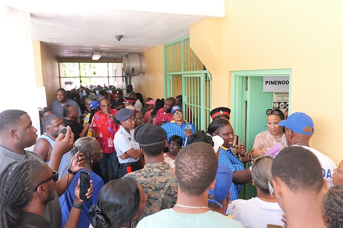 CROWDS of voters face delays and frustrations as they wait to vote during advanced polling yesterday at CV Bethel Senior High School yesterday. Photo: Chappell Whyms Jr