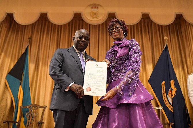 PRIME Minister Philip ‘Brave’ Davis stands with Governor General Dame Cynthia ‘Mother’ Pratt holding the declaration for his second
term as The Bahamas’ Prime Minister. Photo: Shawn Hanna