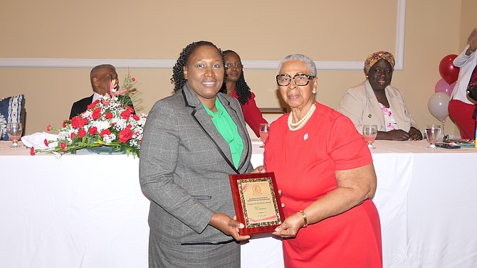 Perky O’Brien, (right) President of Bahamas Association of Administrative Professionals (BAAP) presented the Corporate Excellence Award to Diann Hanna of the Office of the Attorney General and The Ministry of Legal Affairs.