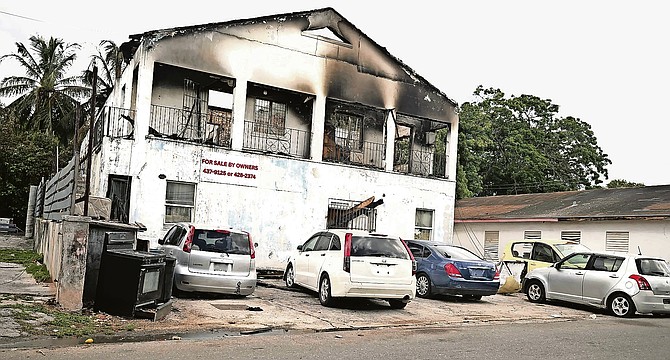 Apartment building scarred by fire which police suspect set by a woman after an altercation with her partner.
Photo Nikia Charlton