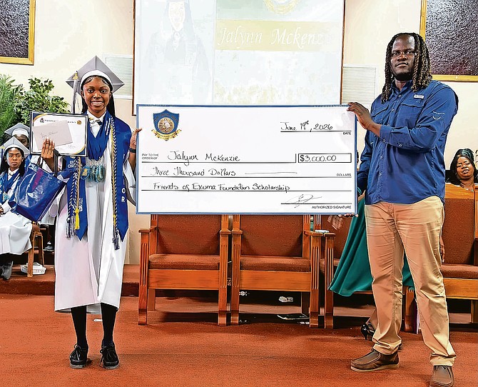 Jaylen McKenzie, a 2026 graduate of Exuma Christian Academy, is presented with a scholarship from Friends of Exuma during the school’s commencement ceremony. McKenzie heads to law school in London this fall with plans to return home as a corporate attorney.