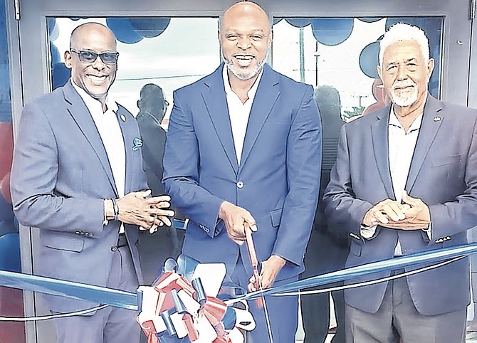 Burton Rodgers (centre), principal of Bahamas Caribbean Dining, the IHOP franchise holder, and Jeffrey Beckles, its chief executive, on July 1st 2026 ribbon-cutting that opened its second Bahamas outlet on Carmichael Road.