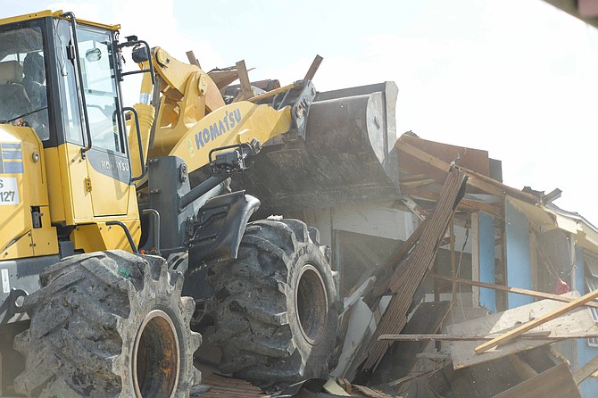 A BULLDOZER knocks down a home at the Montgomery Street shanty town on July 6, 2026. Photo: Shawn Hanna