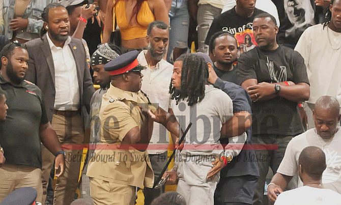 OFFICER seen slapping man in the stands at a FIBA match after police respond to an altercation at the event yesterday.
