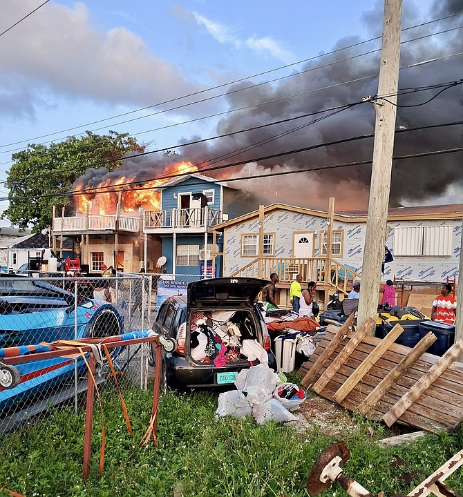 A FIRE at Bailey Town in Bimini destroys at least five structures leaving 20 residents without a home yesterday.