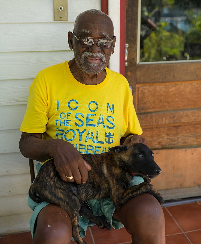 Errol Strachan is pictured with Lassie, a four-month-old Dutch Shepherd puppy gifted to him by the Bahamas Department of Correctional Services (BDOCS).