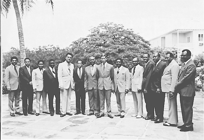 His Royal Highness Prince Charles, now King Charles III, poses with members of The Bahamas' first Independence Cabinet in July 1973. Pictured (left to right) are Anthony Roberts, Paul Adderley, Darrell Rolle, Livingston Coakley, Clement Maynard, Arthur D. Hanna, Sir Milo Butler, His Royal Highness Prince Charles, Sir Lynden Pindling, Carlton Francis, Loftus Roker, Clifford Darling, Simeon Bowe and Secretary to the Cabinet Rodney Bain. (Identifications by Sean McWeeney, KC)