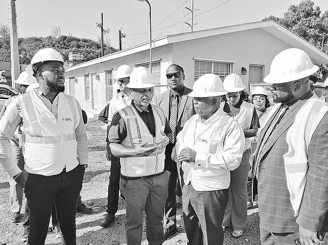 PRIME Minister Philip ‘Brave’ Davis speaks with BPL COO Anthony Christie at the Blue Hill Sub-station yesterday after a transformer fire led to an island-wide blackout. Also pictured are Senators Letrae Rahming and Clint Watson. Photo: Keile Campbell