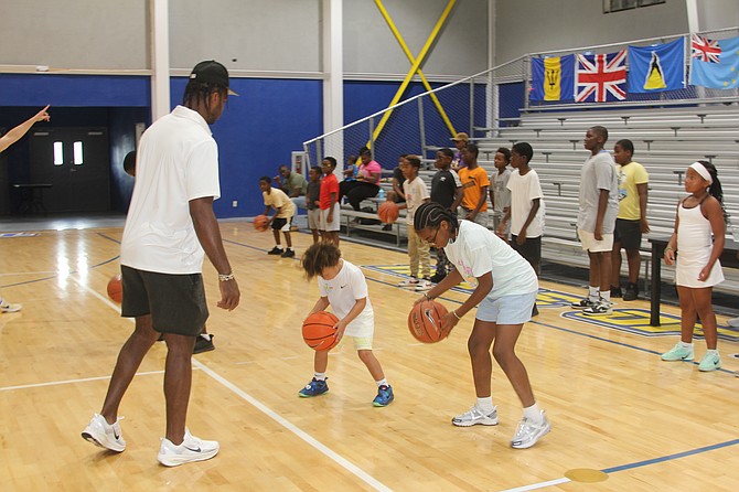 'Buddy' Hield instructs the campers during the 12th annual Buddy Hield Foundation basketball camp in Eight Mile Rock, Grand Bahama. 
Photos: Vandyke Hepburn/BIS