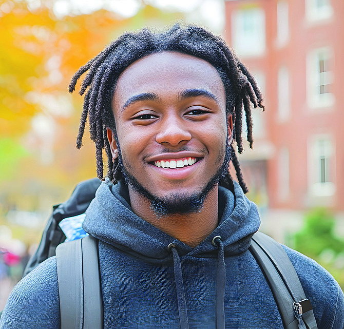 Stock image of a student with dreadlocks.
