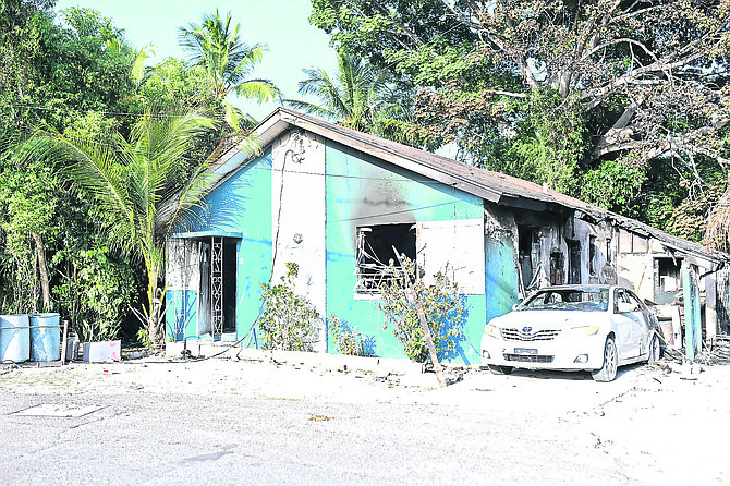 A mother returning home from work and shopping finds house on Johnson Road ablaze on Wednesday.
Photo: Shawn Hanna