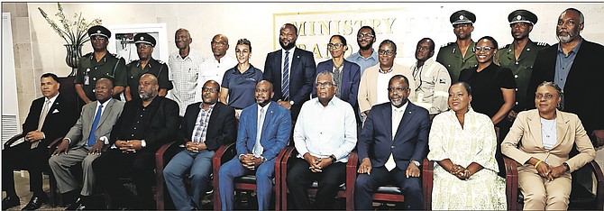 Minister Fred Mitchell (4th right), Attorney General, Wayne Munroe (3rd right), and Minister of State for Immigration in the Ministry of Foreign.
Photo: Andrew Miller/BIS