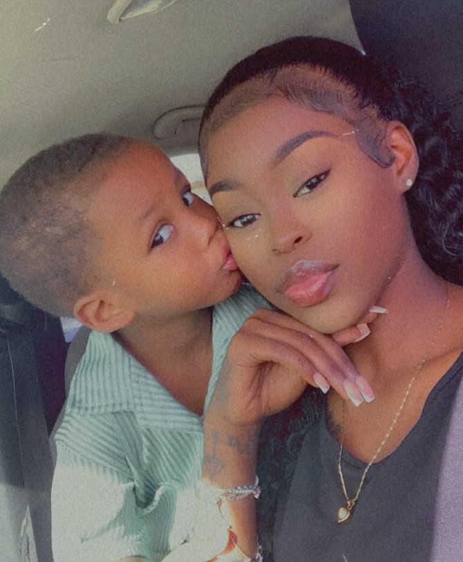 Desire Sands with her son.