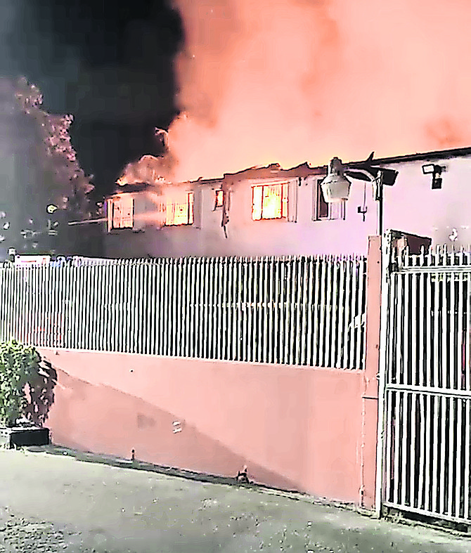 Original Patties Bakery on Tonique Williams-Darling Highway is engulfed in flames on August 23, 2026.