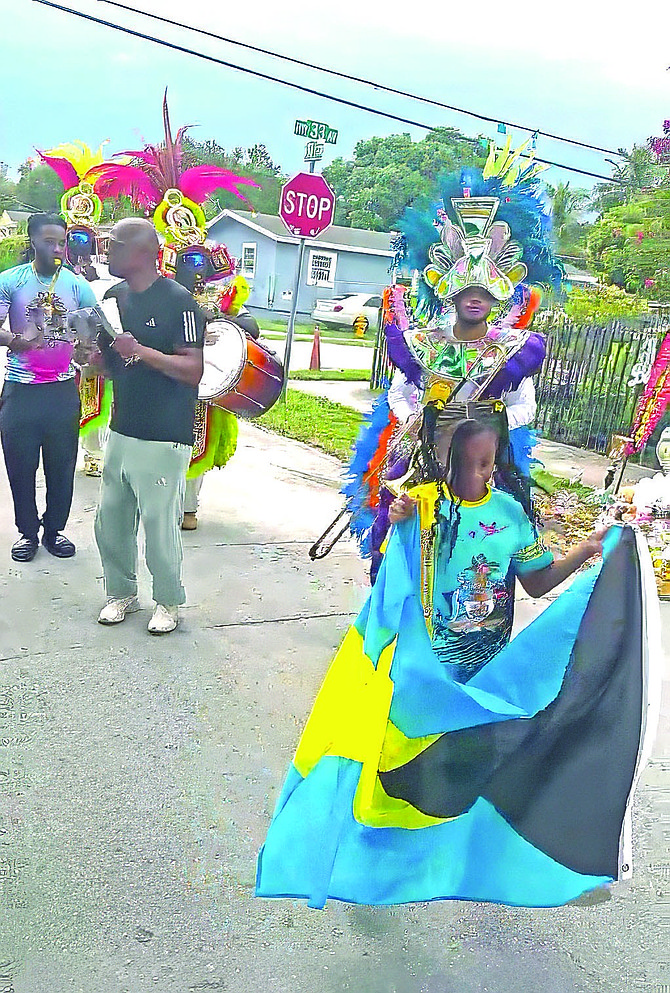 Family and friends gather at the street corner where Stefan ‘Legend’ Davis was killed in a traffic accident in Miami last week.