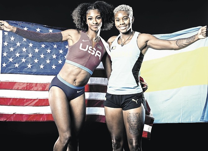 Masai Russell and Devynne Charlton, right, draped in their American and Bahamian flags respectively.