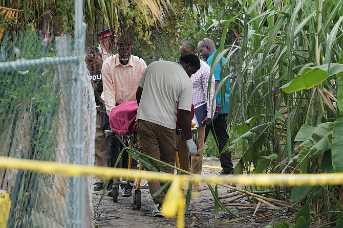 A man’s body is removed from his residence on Cowpen Road after he was fattally shot by gunmen on September 23, 2026. Photo: Chappell Whyms Jr