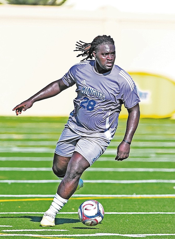 The University of The Bahamas Mingoes defender Lamond Cross (Grey #28)
surveys the field during his match against Trinity College of Florida at Mullins Park in Coral Springs,Florida on Saturday, September 26.
Photo: UB ATHLETICS