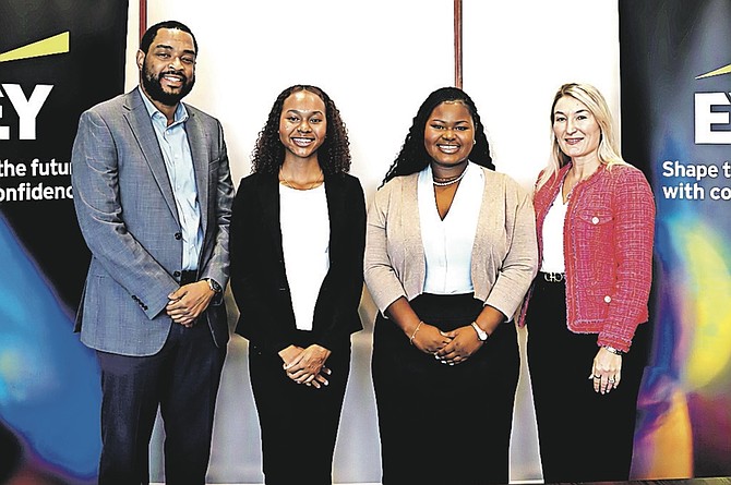 RECIPIENTS of Jamaine McFall Bahamas Scholarship, Claire Bethel and Avani Sawyer with E&Y’s Donillo Culmer and Tiffany Norris-Pilcher.