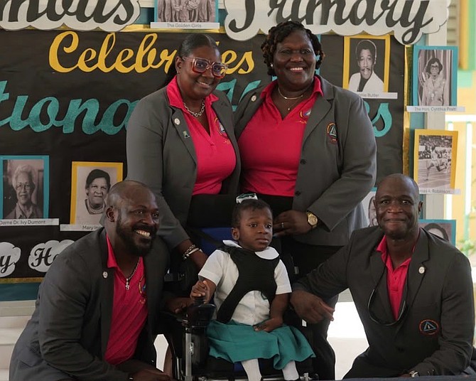 10-year-old Naveah Strachan, tries out her new motorised wheelchair donated by the Bahamas Educators Managerial Union (BEMU)