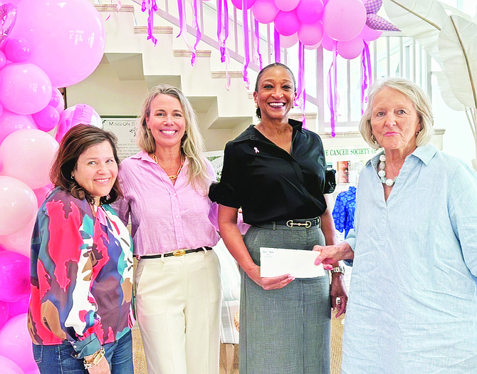 (L-R) Pretty in Pink organisers, Kelly Meister, Blue Lagoon Island, Heather Cowper, Coldwell Banker and Inga Bowleg, John Bull present $17,000 check to Susan Roberts Founder of The Cancers Society of The Bahamas.