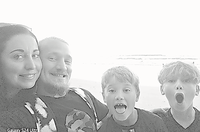 LEANNE GREGORY with her husband Nathan and their two sons.