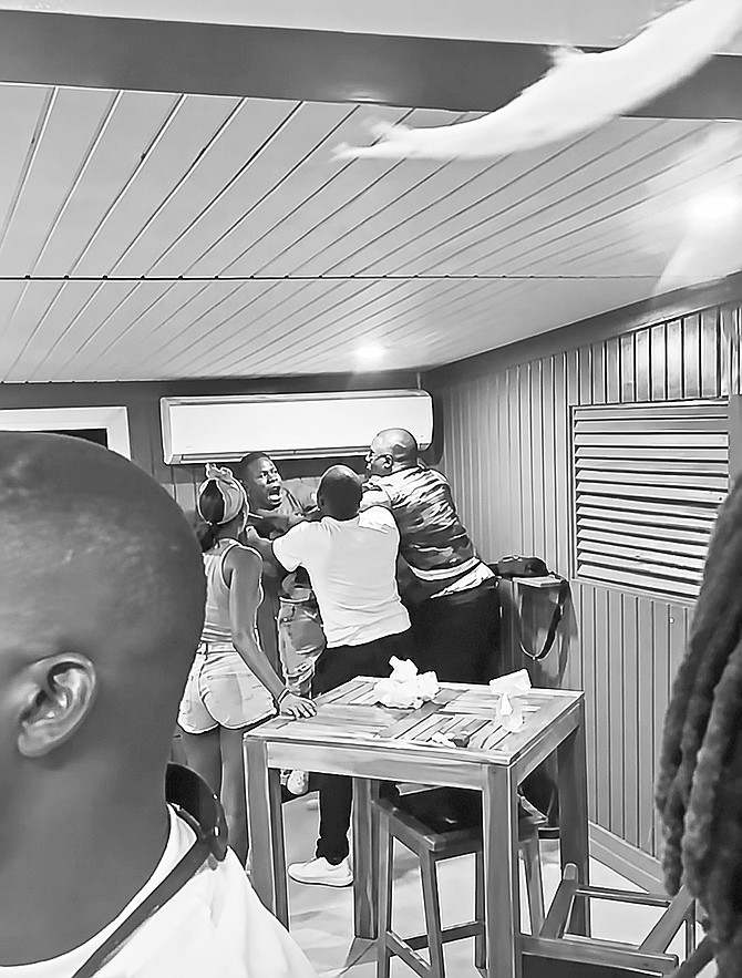 Video capture of a fight in an Exuma establishment between two men, one of whom was identified as a police officer.