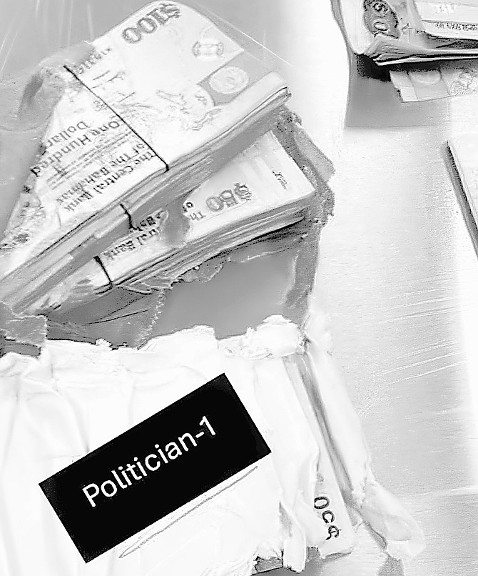 Package with cash in it with redacted name of ‘Politican-1’