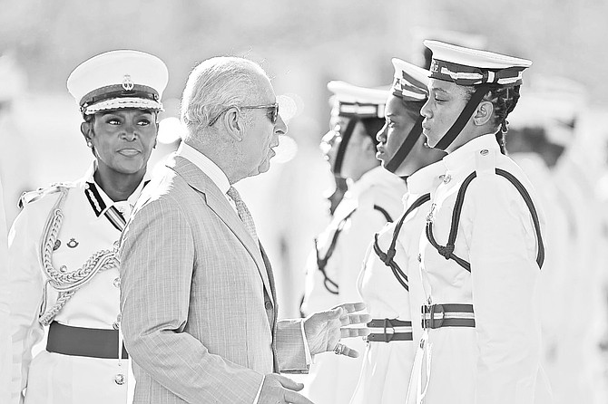KING Charles III stops to speak with RBDF Marine Judy Forbes’ 25, during the event marking his first arrival in The Bahamas as king.
Photo: Eric Rose/BIS