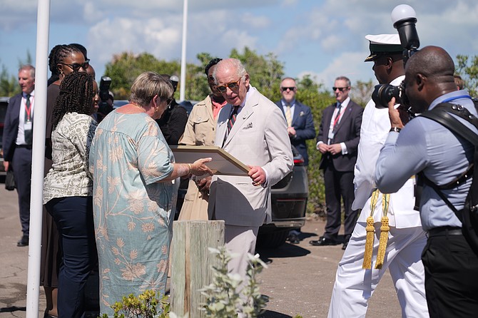 King Charles III reviews a gift commemorating his visit to the Bonefish National Park on October 28, 2026.