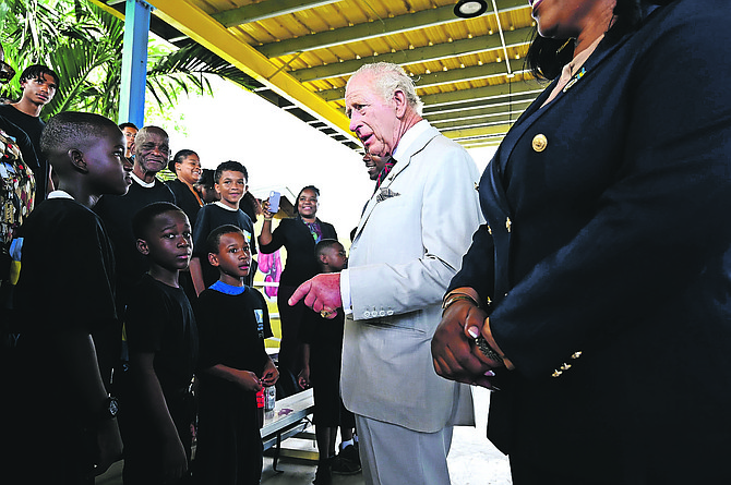 KING Charles III stops to speak with young people during his visit to the Bahamas Boxing Academy.
Photo: Shawn Hanna