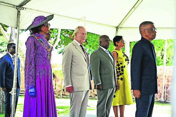 Governor General Dame Cynthia 'Mother' Pratt stands by the King along with Prime Minister Philip 'Brave' Davis and his wife Ann Marie Davis.