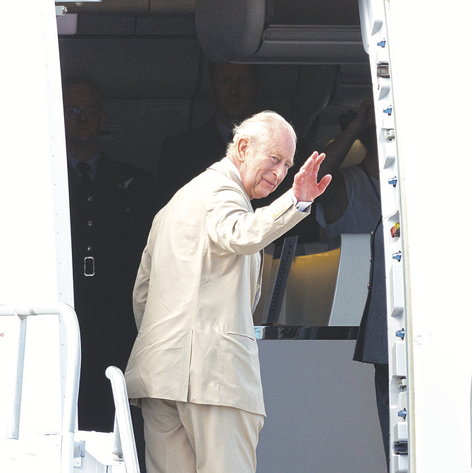 BRITAIN’S King Charles III waves before boarding the royal plane at Lynden Pindling International Airport in Nassau, Bahamas, yesterday.
Photo: Tim Aylen/BIS